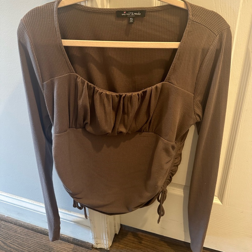 Brown long sleeve top.